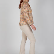 Jeans flare beige con baschina in punto Milano stretch